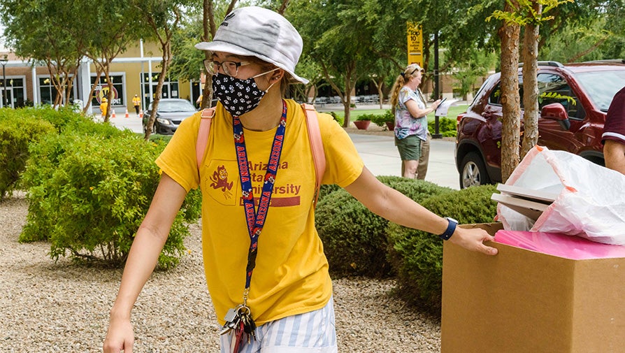 Student moving items at West move-in