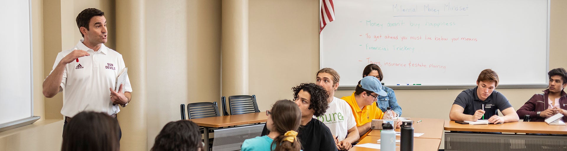 Barrett alumni lecturing Barrett students in a classroom environment