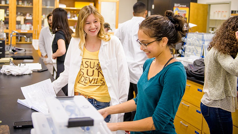 Two Barrett students working together in a lab