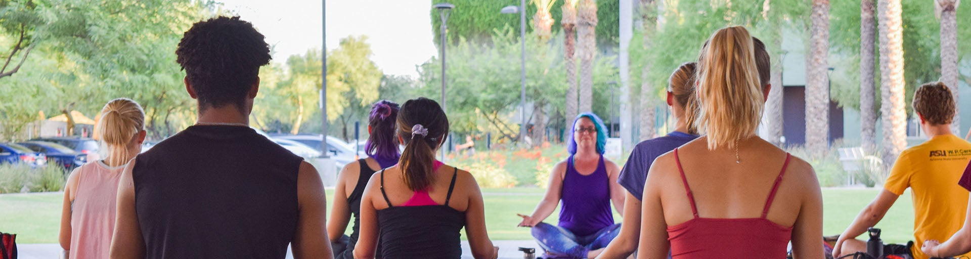 Students doing yoga under the ASU dome