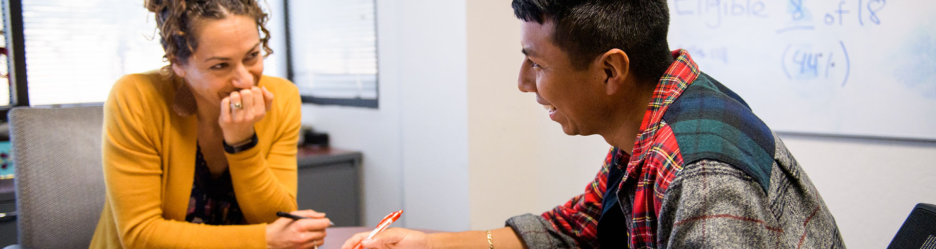 Advisor talking with a student in an office