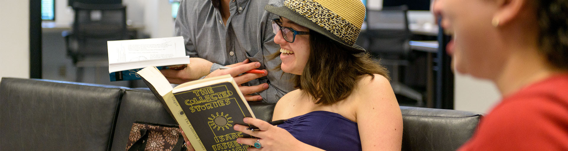 Several students having an academic discussion while holding books